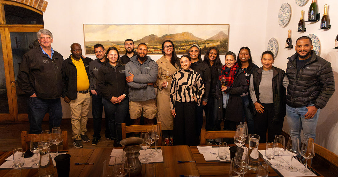 Charles Hopkins Marks 17 Years of Mentorship with a Toast to His Protégés