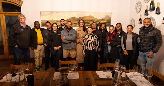 Charles Hopkins Marks 17 Years of Mentorship with a Toast to His Protégés